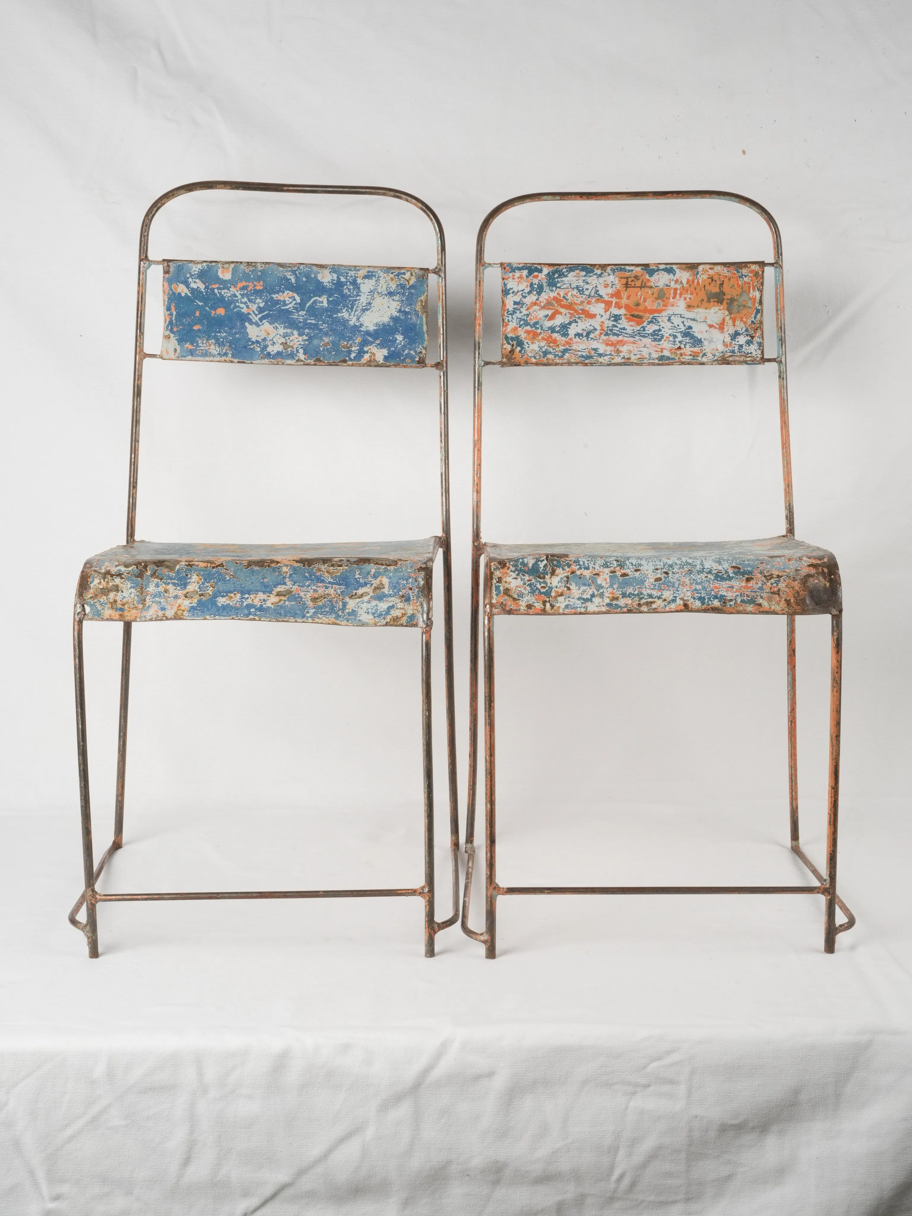 Pair of industrial metal garden chairs w/ blue patina