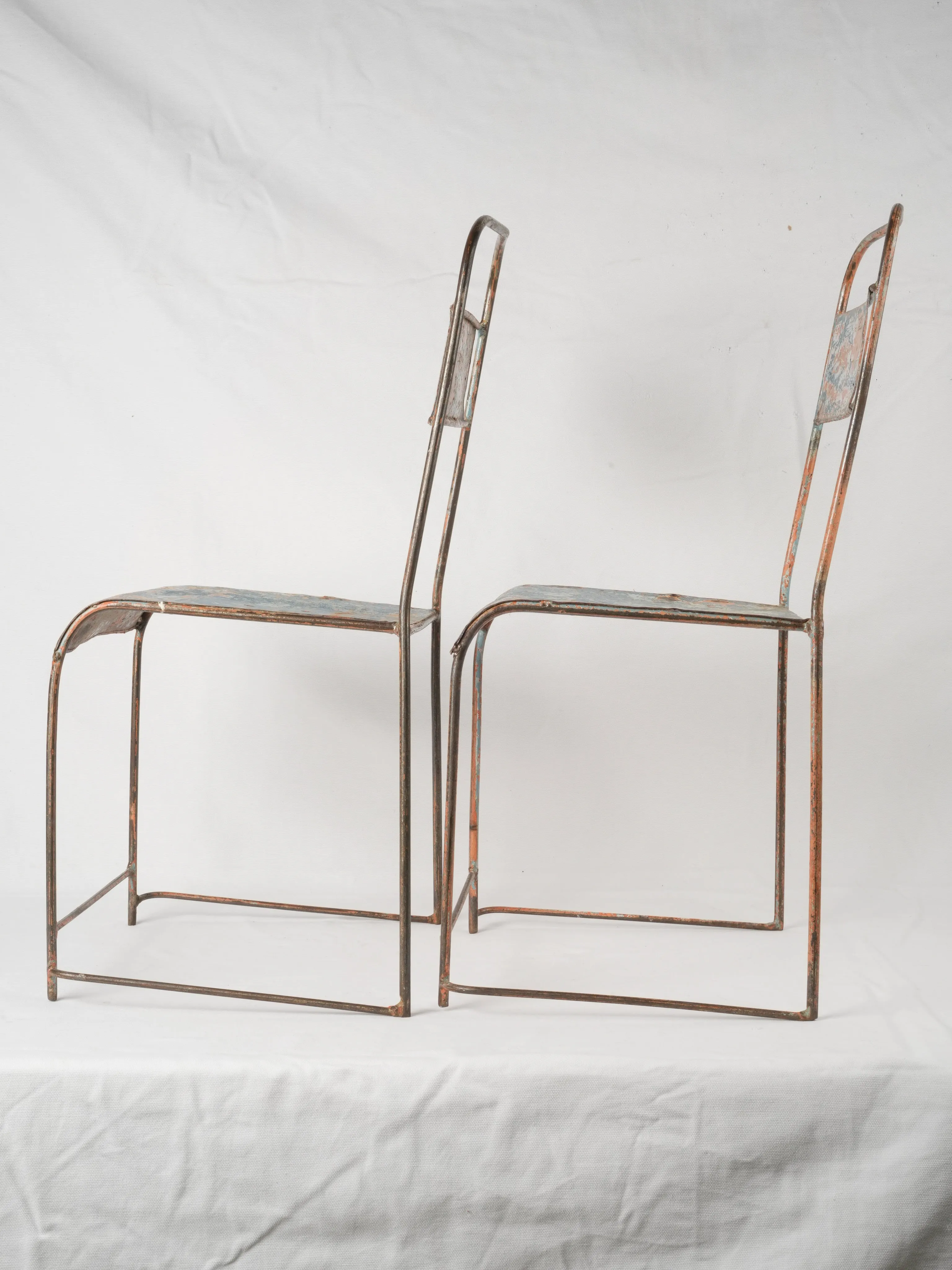 Pair of industrial metal garden chairs w/ blue patina