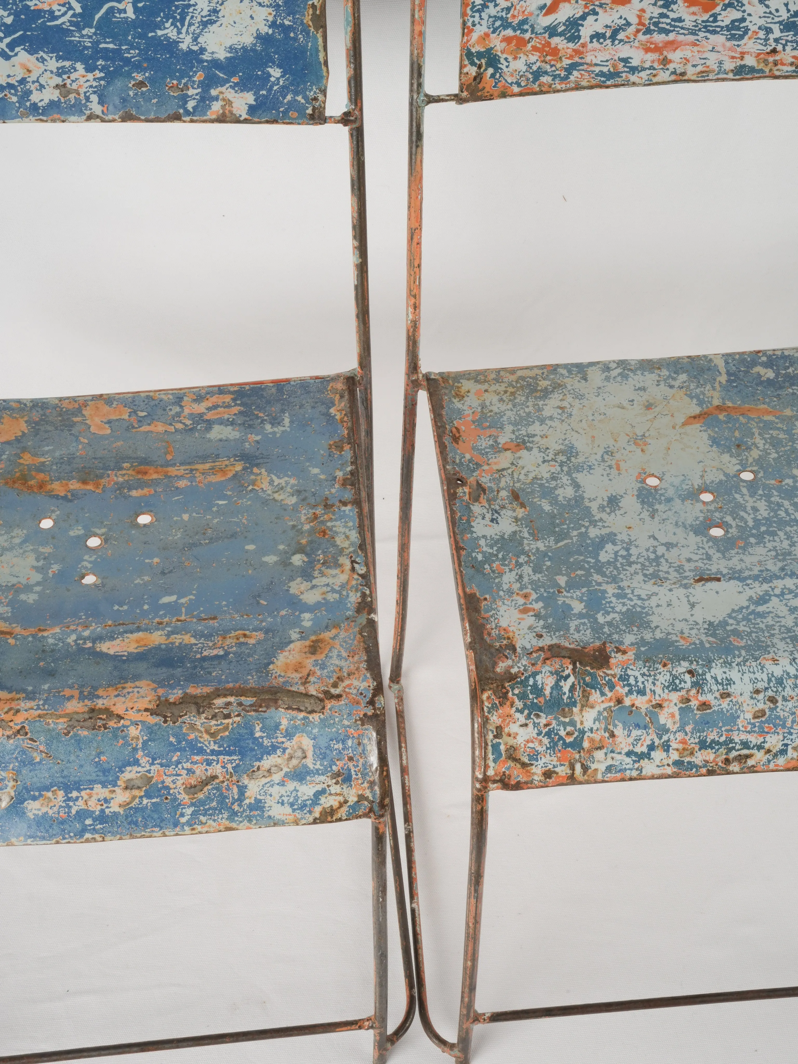 Pair of industrial metal garden chairs w/ blue patina