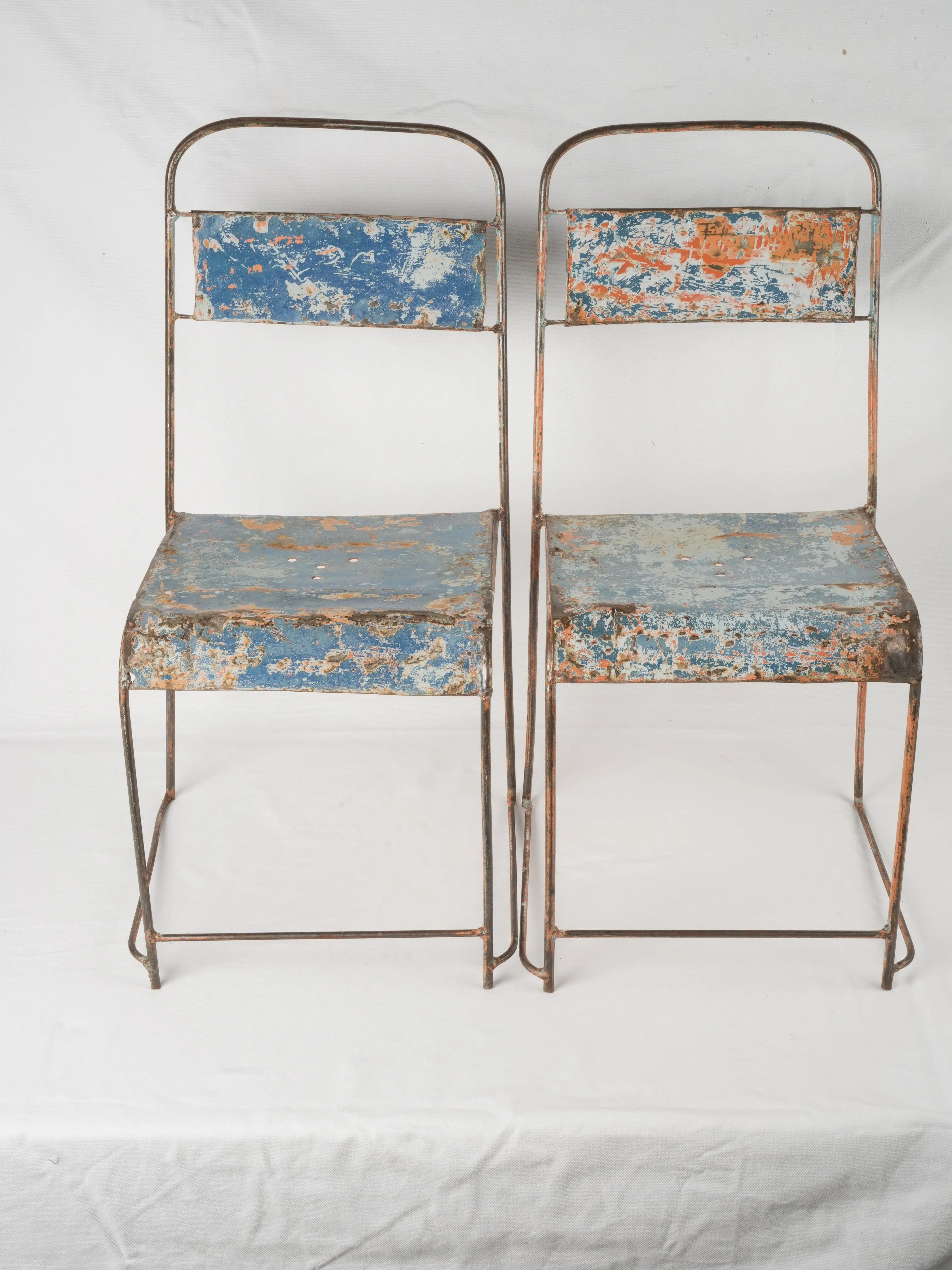 Pair of industrial metal garden chairs w/ blue patina