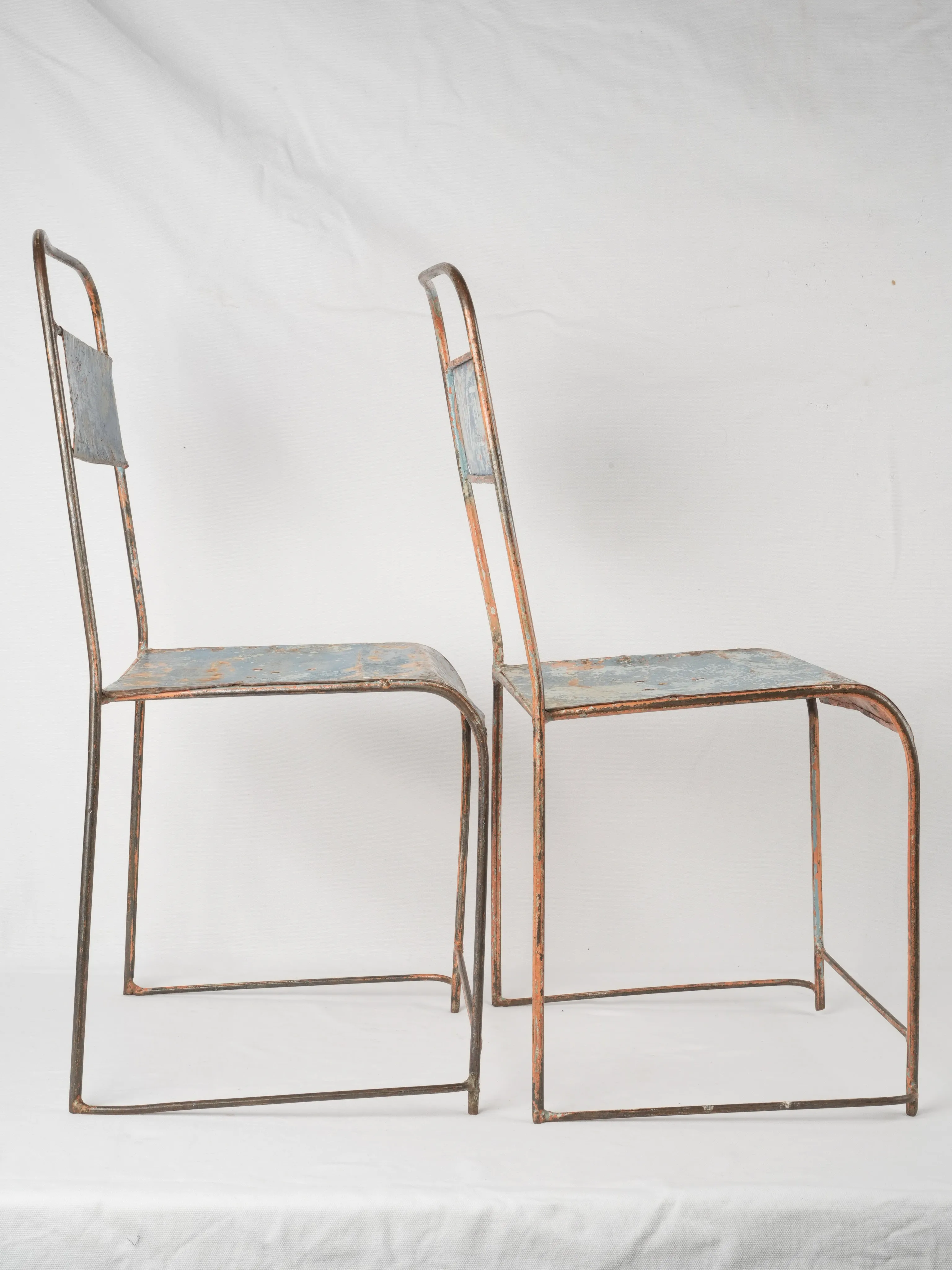 Pair of industrial metal garden chairs w/ blue patina